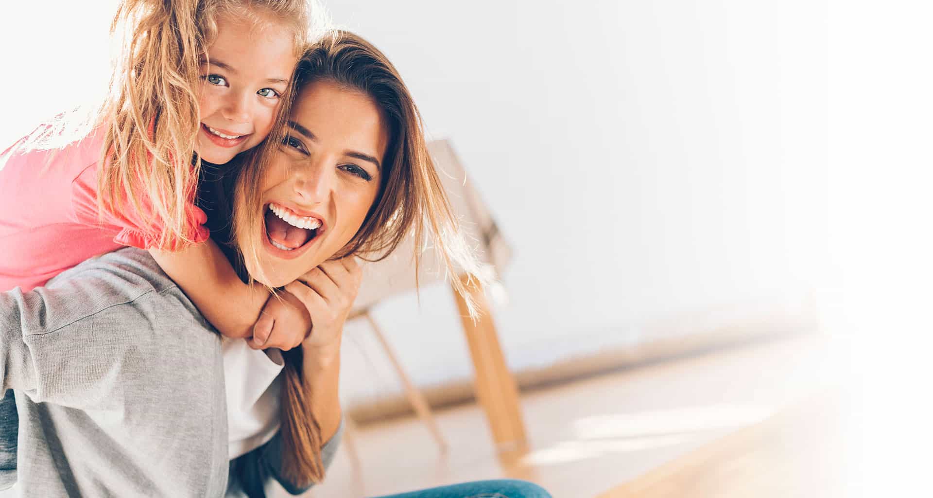 Mother and daughter laughing together