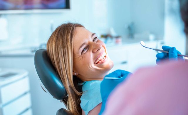 Female at dentist having her teeth whitened