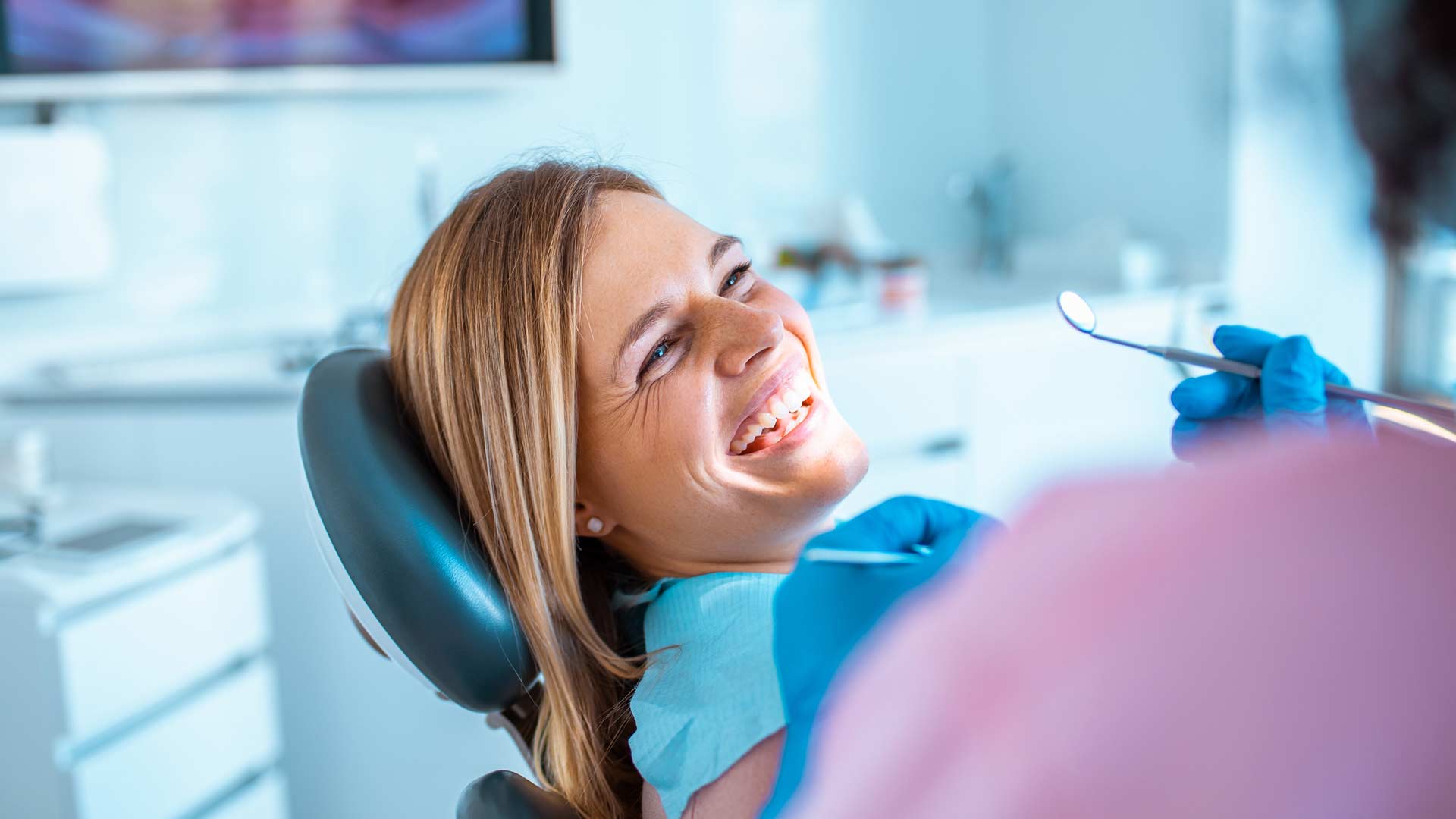 Female at dentist having her teeth whitened