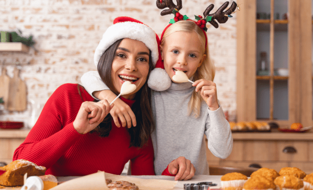 mom and daughter eating holiday treats
